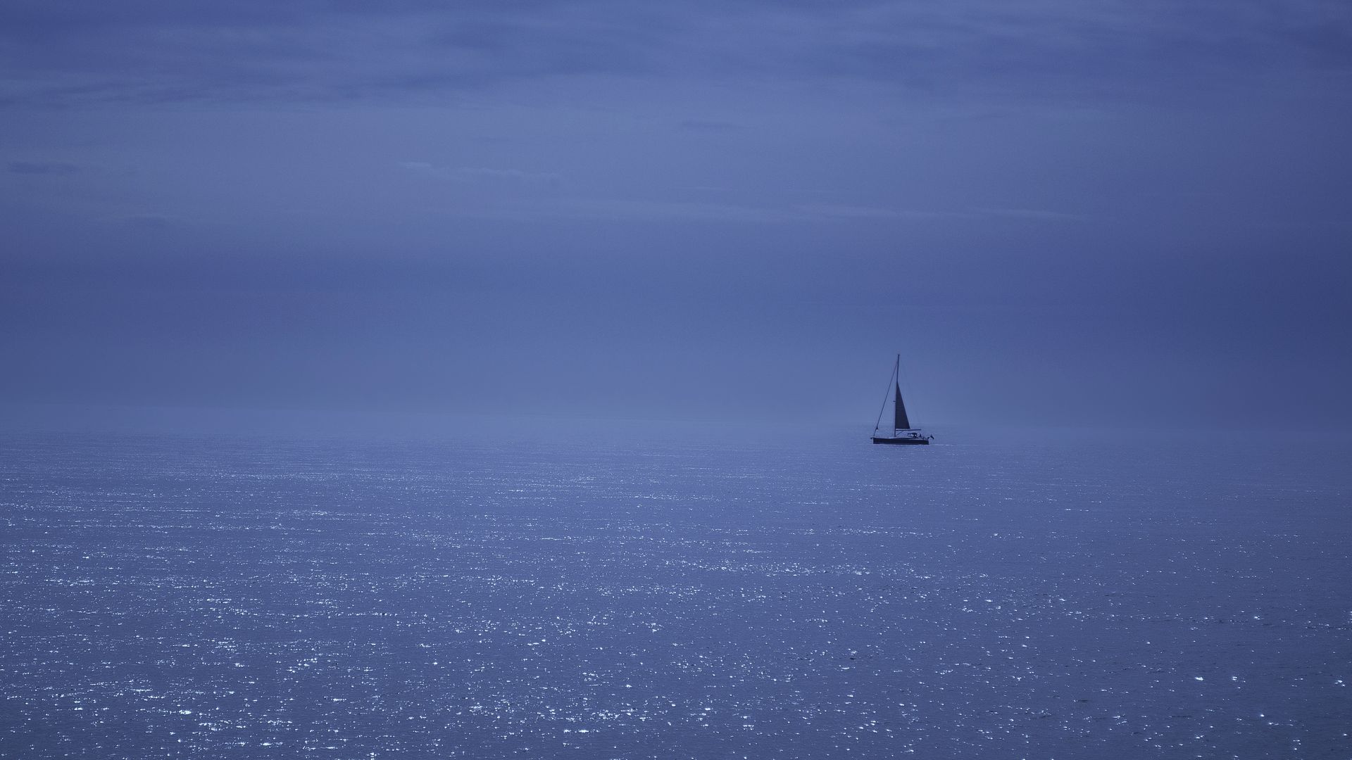 A lone yacht under sail on the open Adriatic.