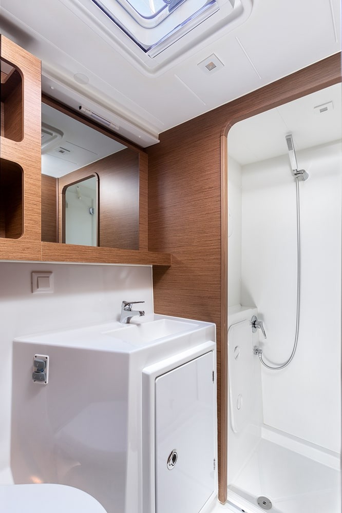 Heads compartment of the Lagoon 42 with washbasin, mirror cabinet and separate shower stall