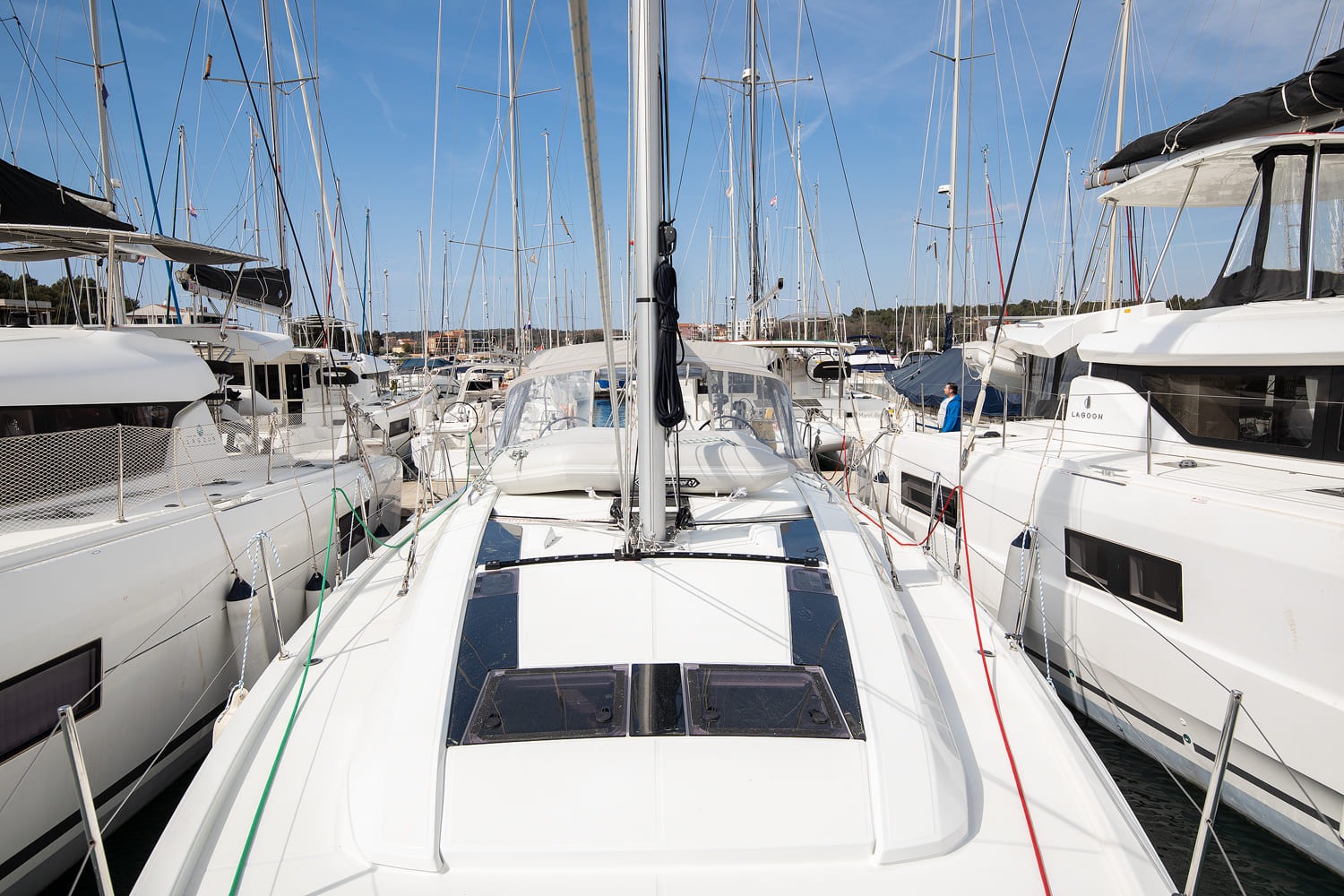 Looking forward along the coachroof to the mast and furling headsail