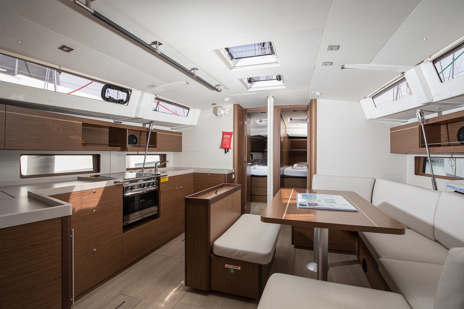Saloon looking forward past the galley to the open forward cabin
