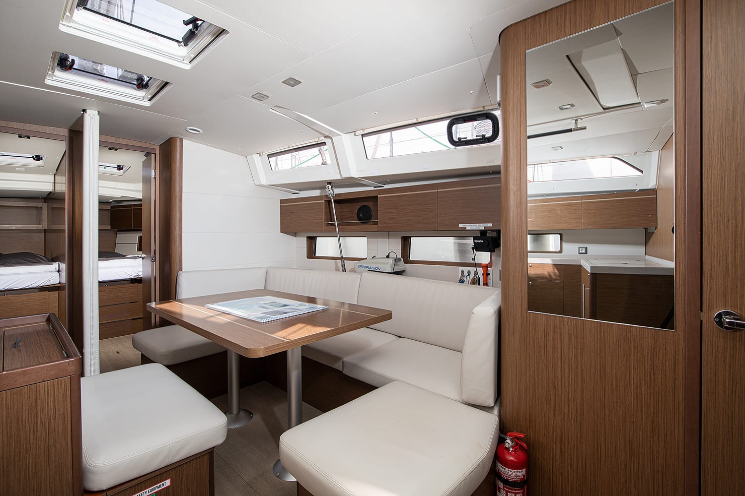 Saloon dinette with wraparound settee and drop-leaf table