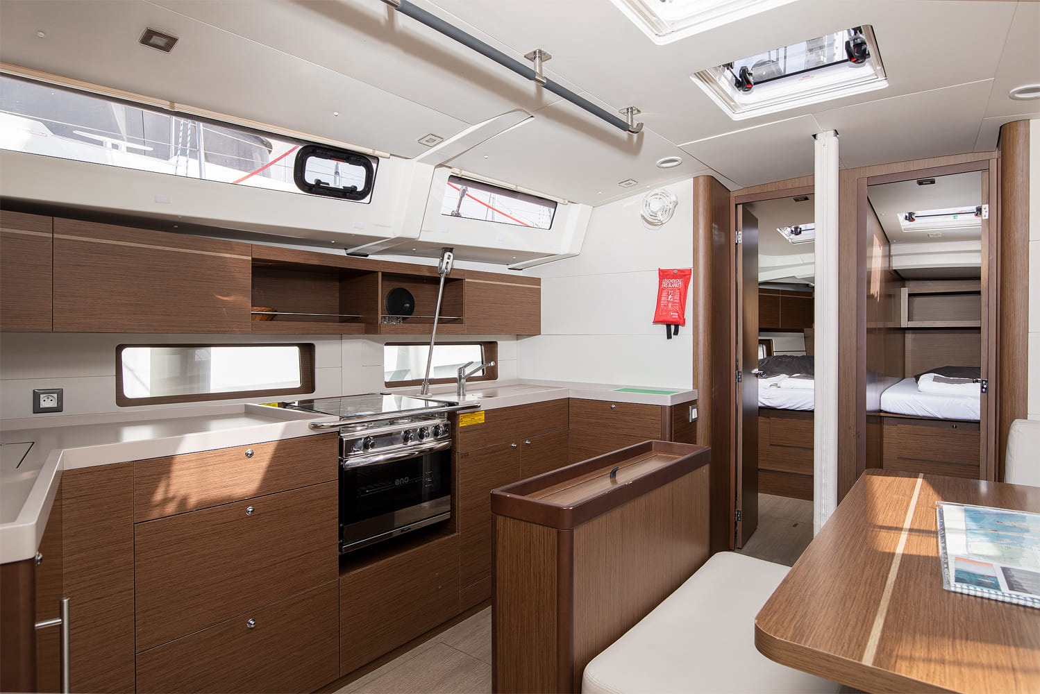 Galley with gas oven, three-burner hob, twin sinks and worktop