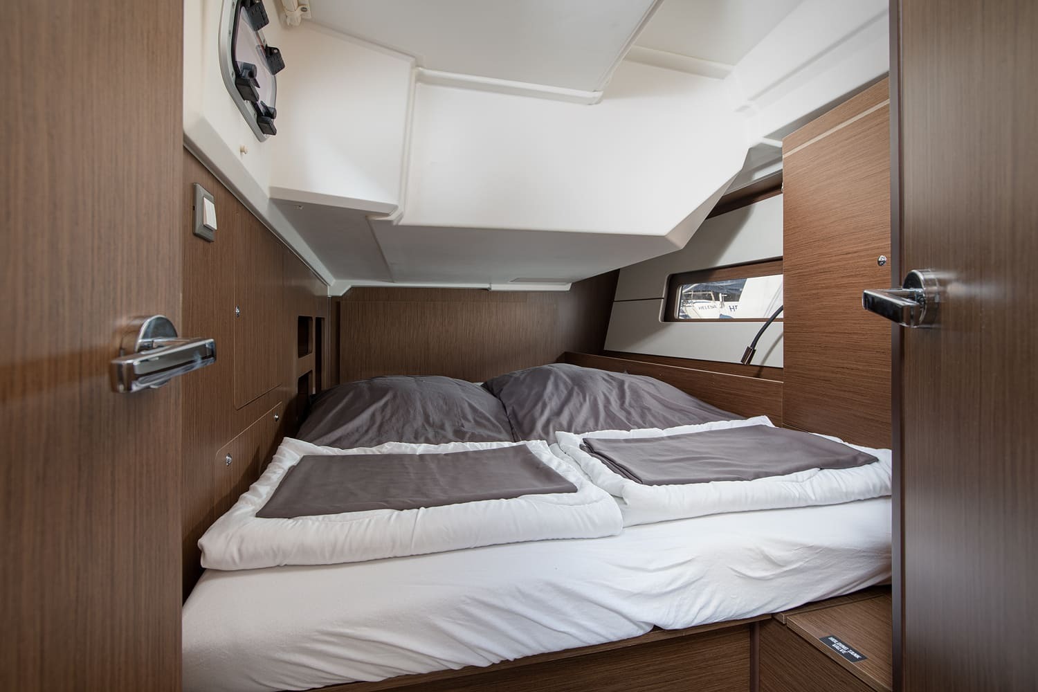 Forward double cabin with wide berth and overhead hatch