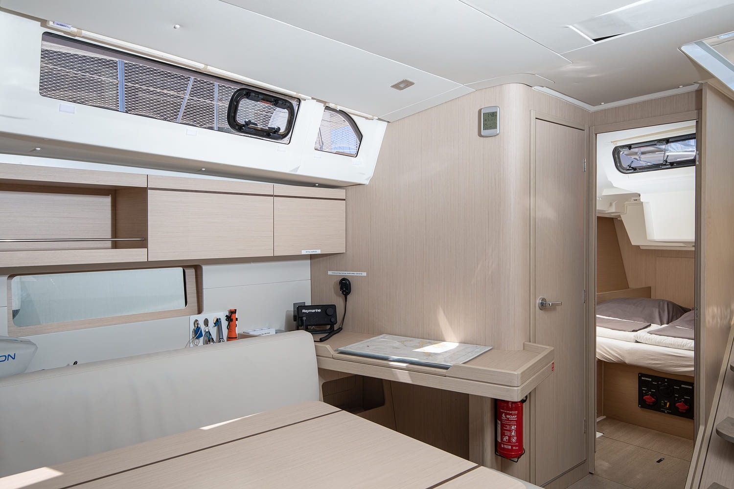 Saloon looking aft, chart table and companionway steps