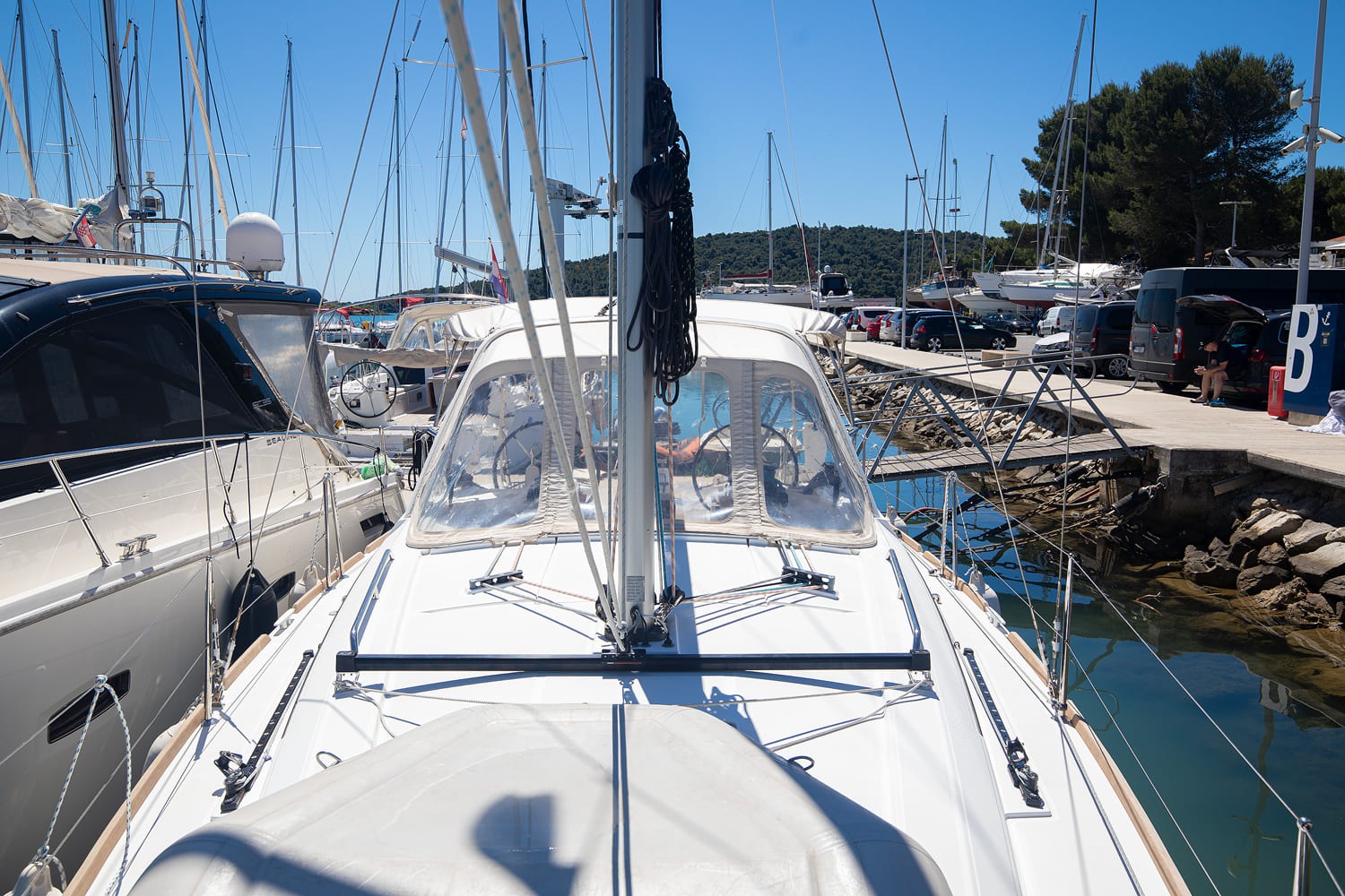 Side deck and coachroof looking forward, marina berths beyond