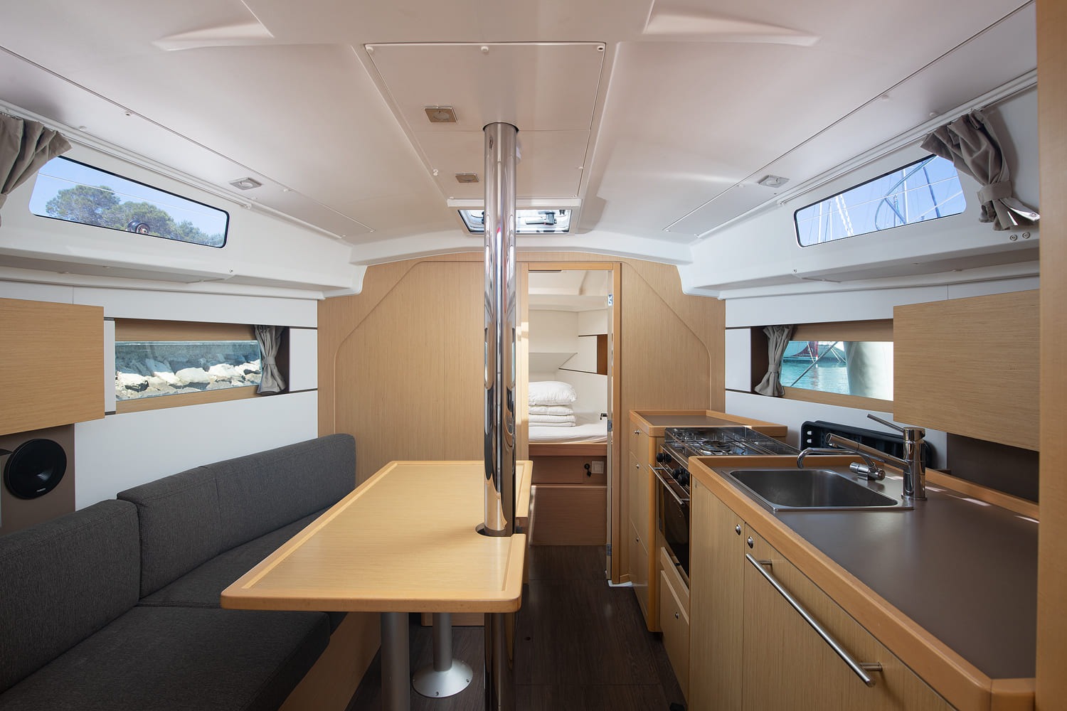 Saloon with dining table and settees either side