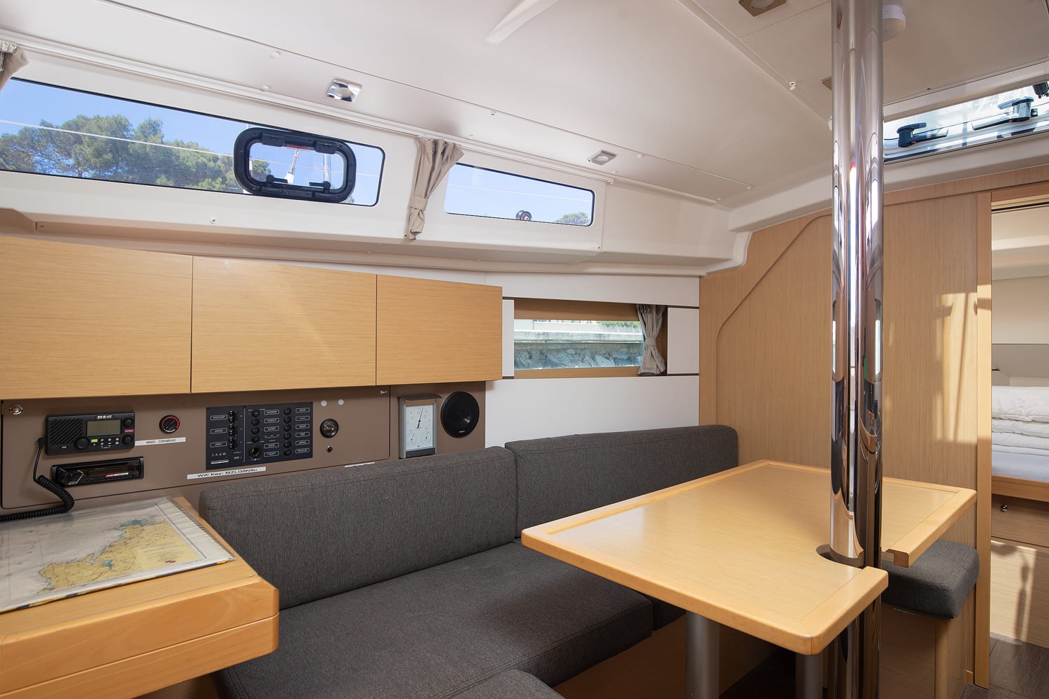 Saloon seating and table beneath the hull windows