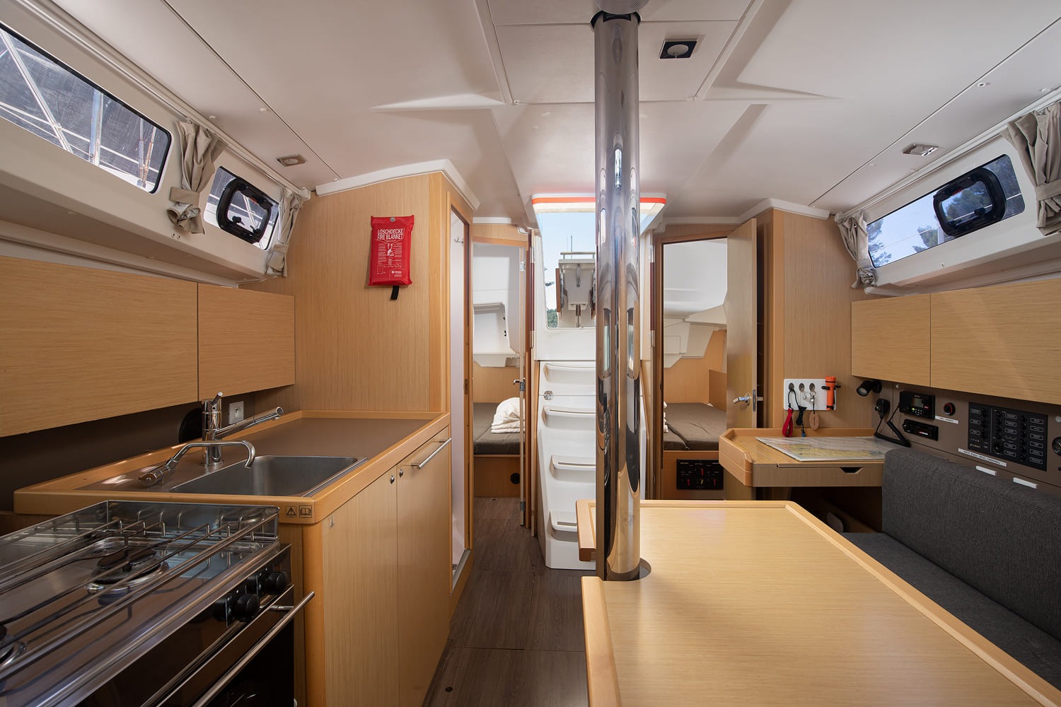 Galley with hob and sink, saloon visible beyond