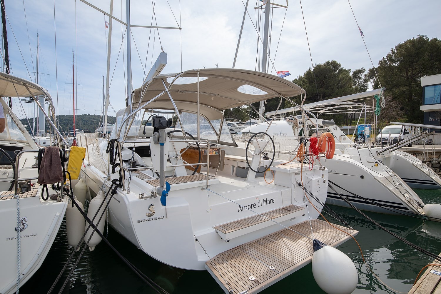 The bow of Amore di Mare seen from the pontoon in ACI Marina Pomer, with the anchor and forestay