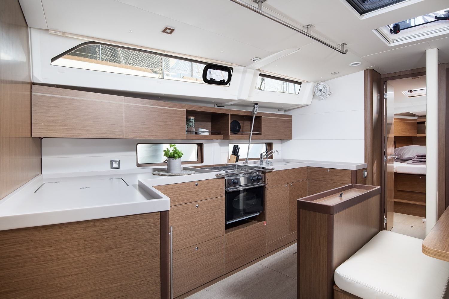 Galley and saloon of the Vento di Mare seen from the companionway steps.