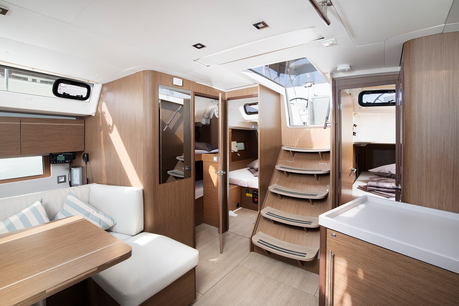 Companionway steps and cabin doors aboard the Vento di Mare, looking through the interior.